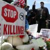 Mikhail Muhammad, center, leads a protest by the New Black Panther Party on Sat.
